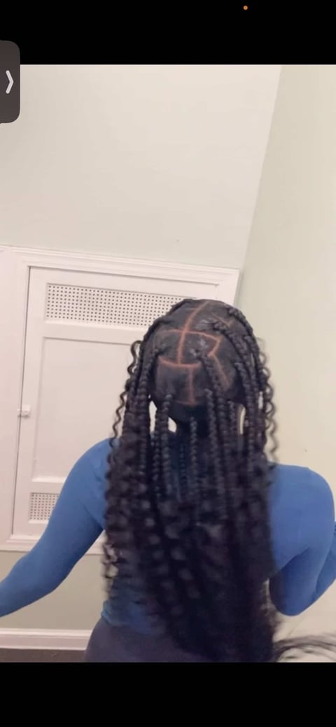 Long dark braided hair with geometric pattern